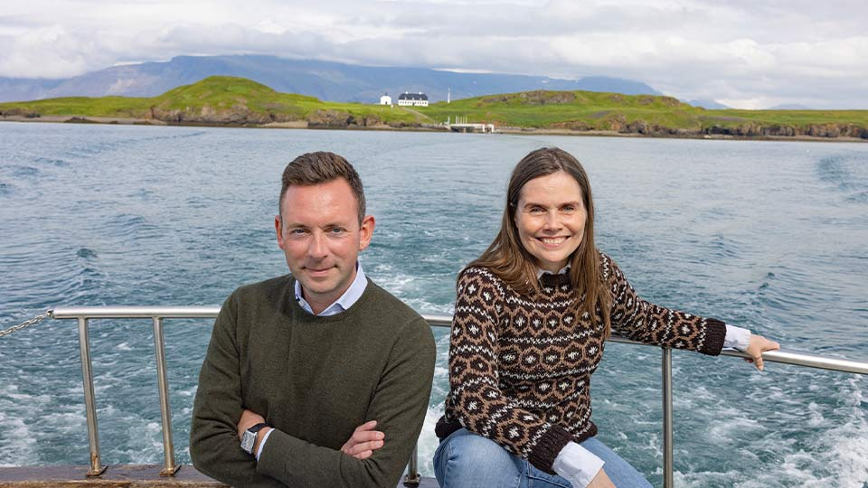 A photograph of Katrín Jakobsdóttir & Ragnar Jónasson on a boat at sea